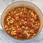 A hearty pot of classic American goulash with macaroni, ground beef, and tomatoes