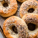 Close-up of freshly baked homemade high-protein bagels topped with everything bagel seasoning.